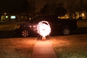 Nani playing with a sparkler on New Year's.